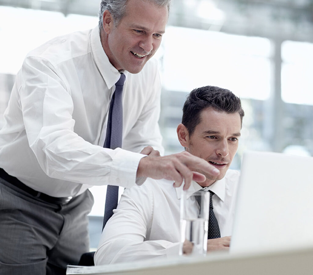Certified Public Accountant Near Me looking at computer